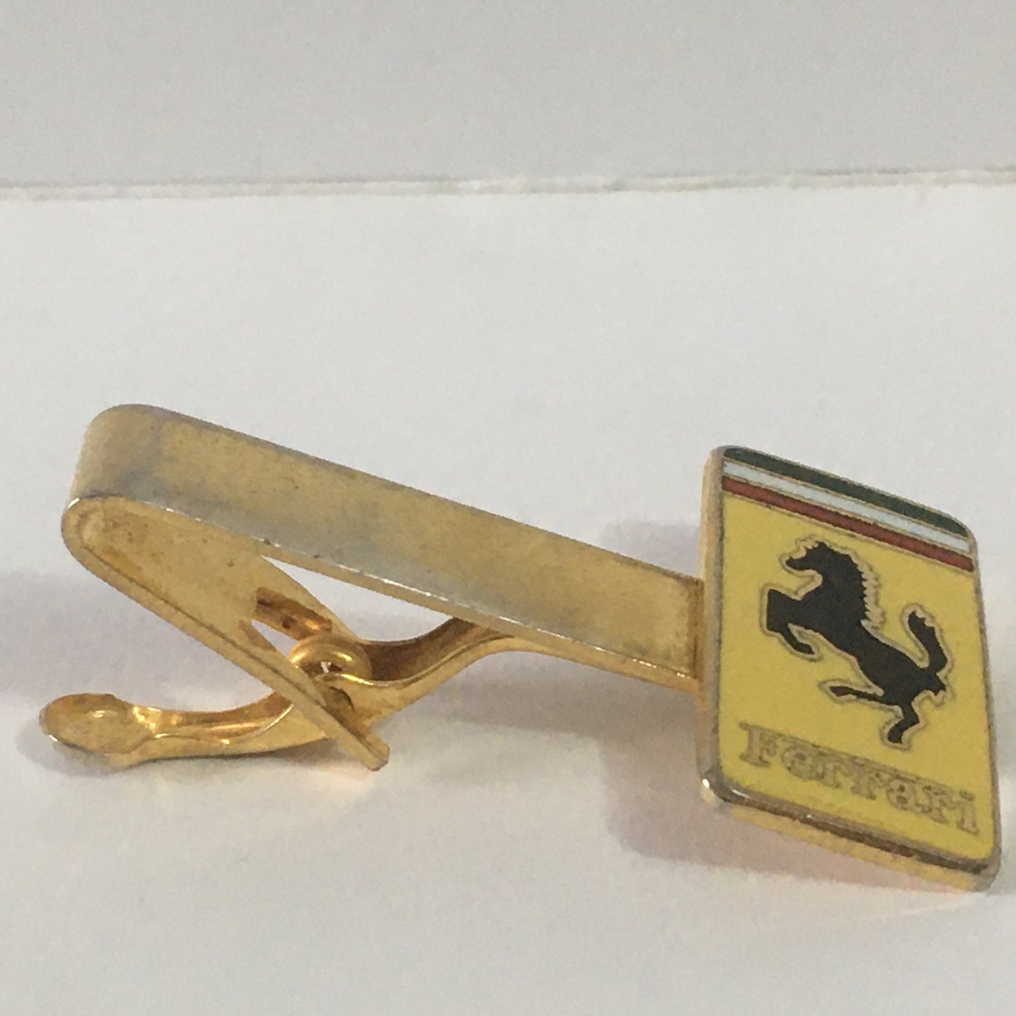 Ferrari Tie Clip in Gold Colored Metal with Enamelled Ferrari Emblem